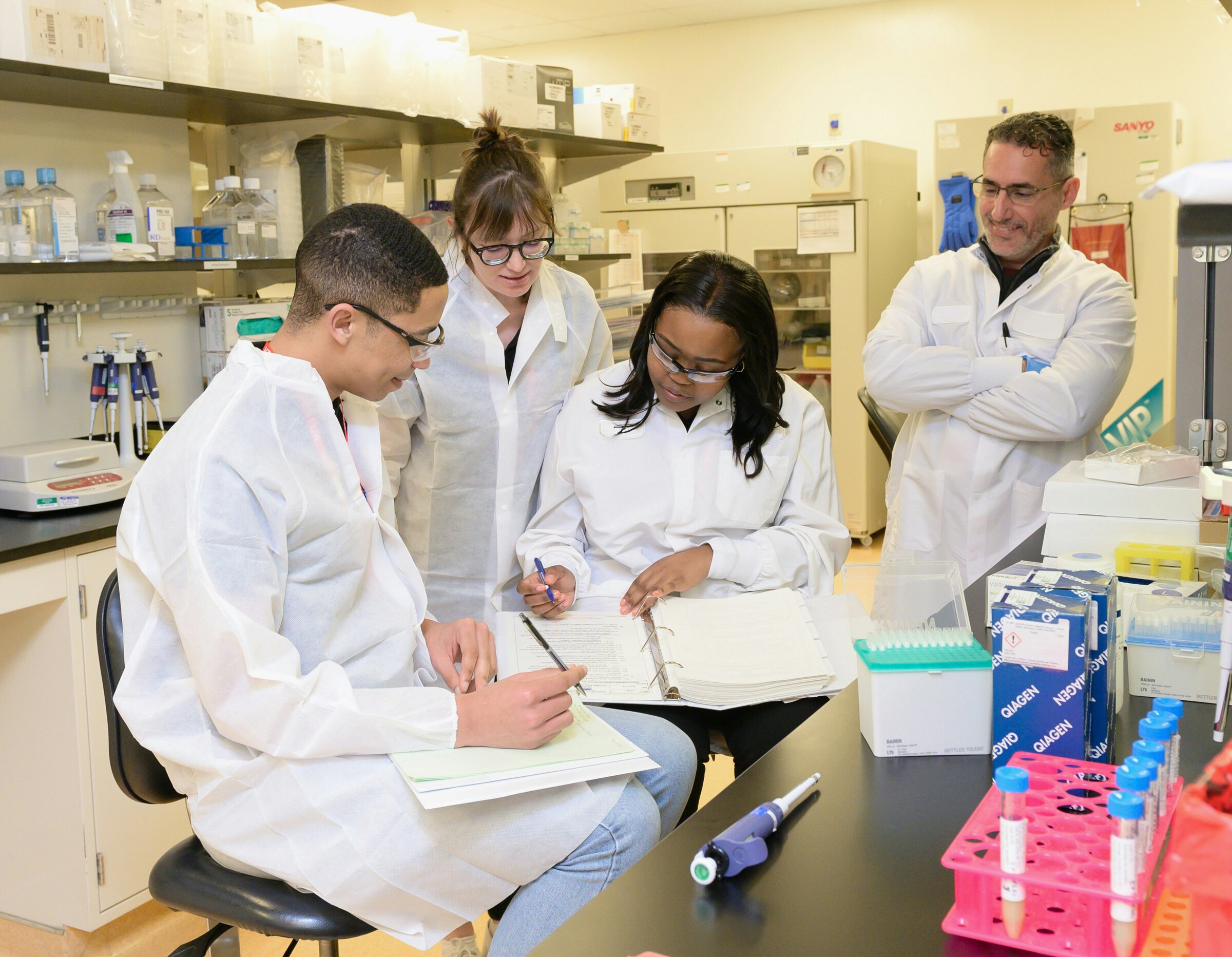 Researchers reviewing information together in a laboratory environment