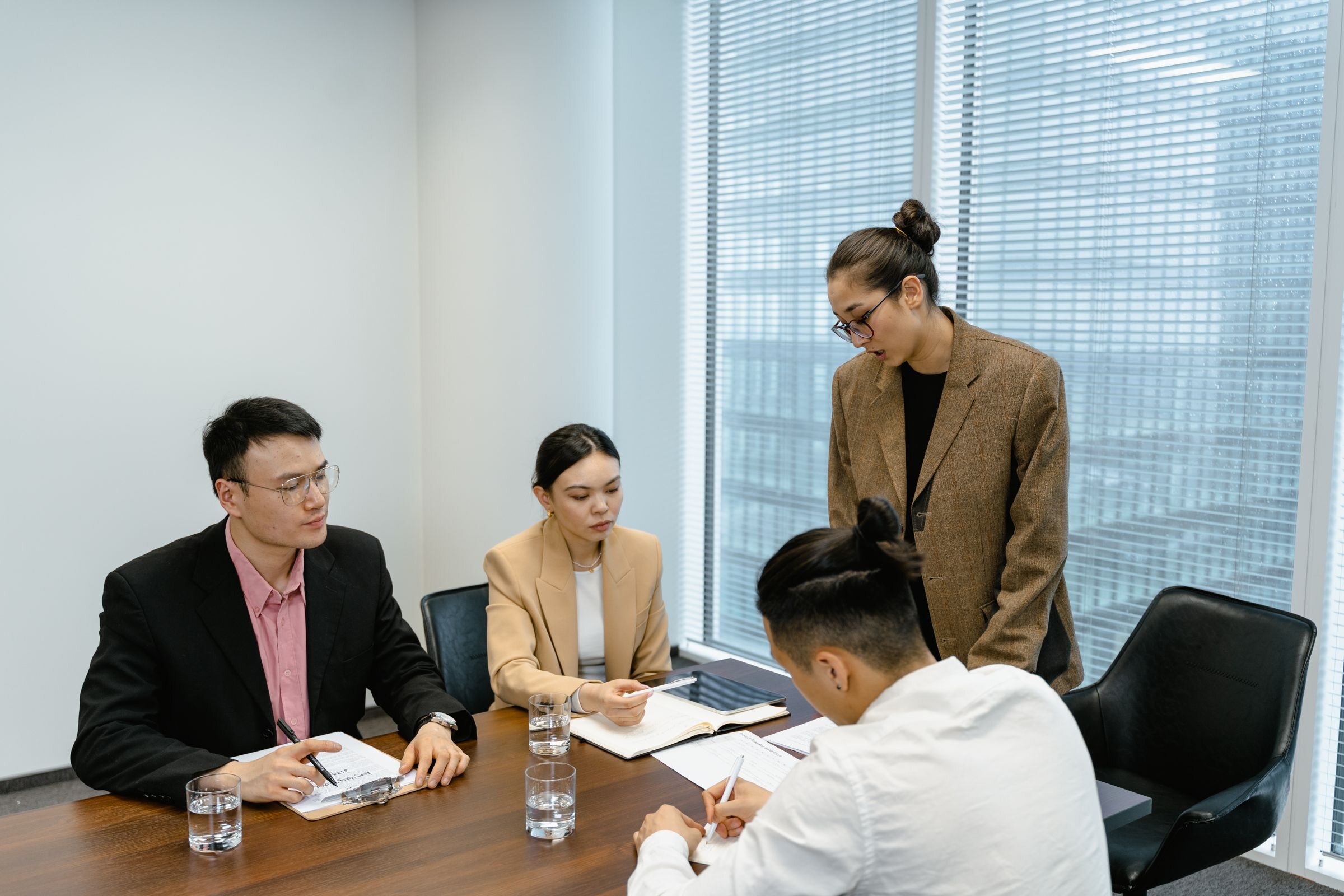 Professionals coordinating work around a client service mandate